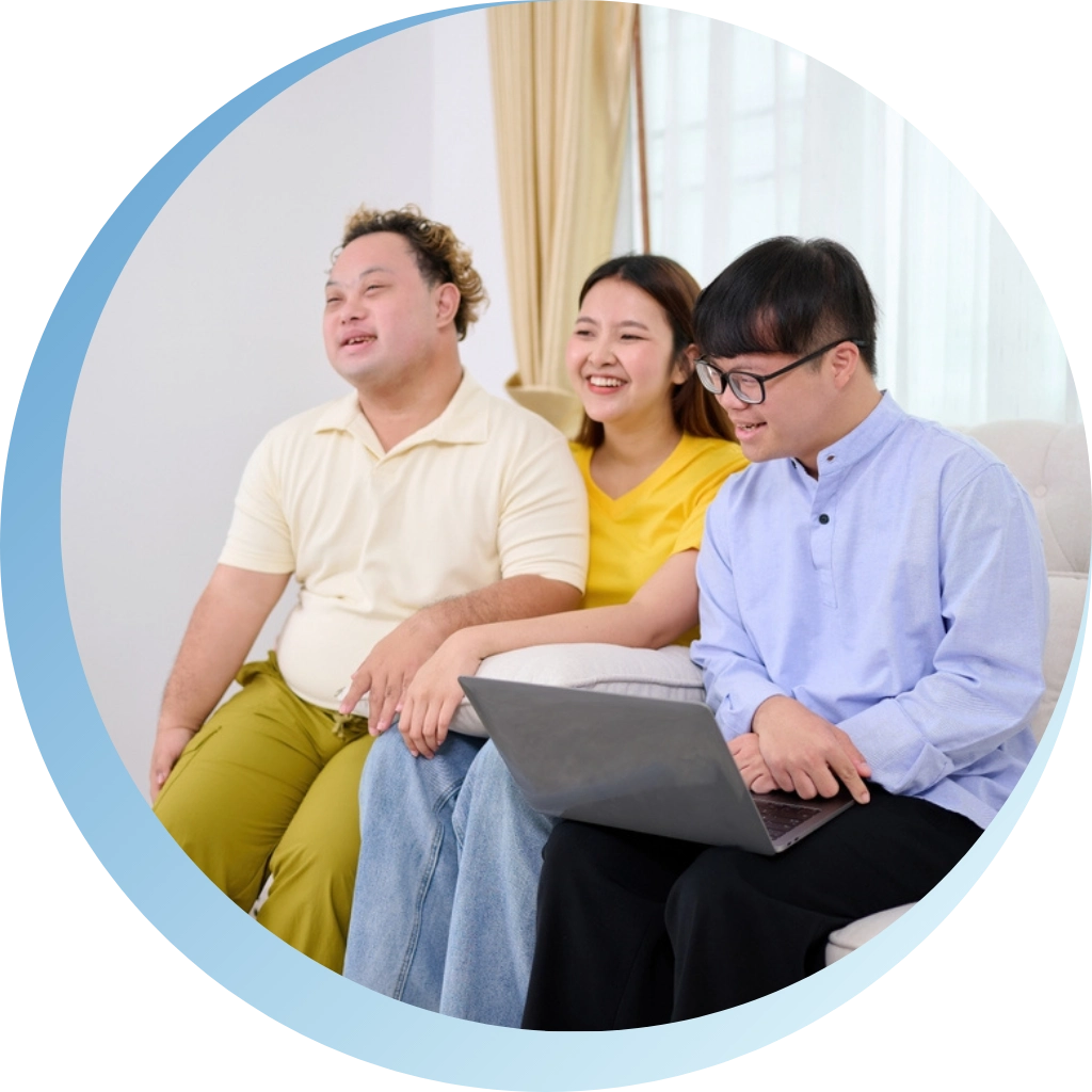 group of disabled friends with down syndrome disability sitting on sofa